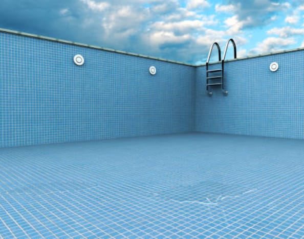 Empty swimming pool illustrating water loss from a pool leak
